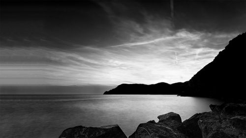 View of calm sea against cloudy sky