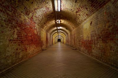 Empty illuminated old tunnel