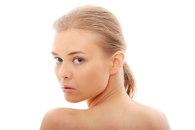 Portrait of a beautiful young woman over white background