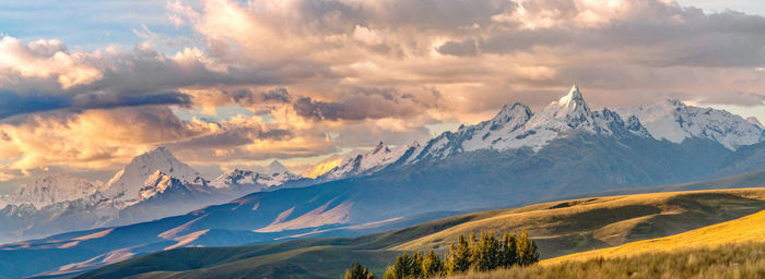 Scenic view of mountains against cloudy sky