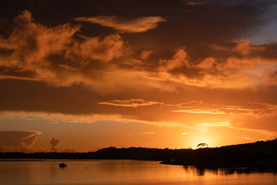 Scenic view of lake against sky during sunset