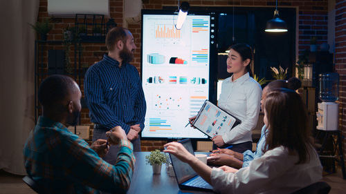 High angle view of business colleagues working at office