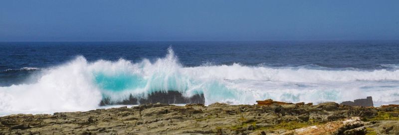 Panoramic shot of sea against clear sky