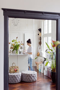 Woman reflecting in bedroom mirror