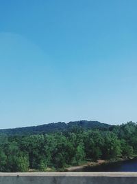 Scenic view of mountains against clear blue sky