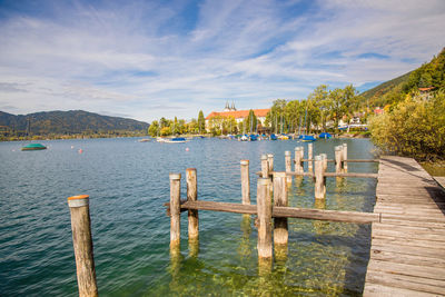 Pier over lake against sky