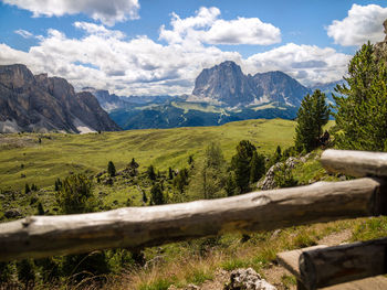 Scenic view of mountains against cloudy sky