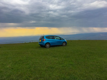 Car on land against sky