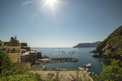 Buildings by sea against sky at cinque terre