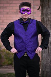 Portrait of young man wearing sunglasses standing against wall