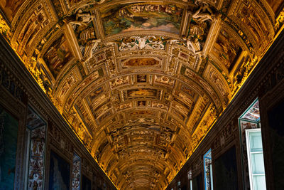 Magnificent golden ceiling in the alleys of the vatican in rome, italy