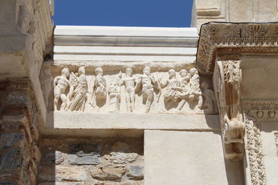 Low angle view of statue against building