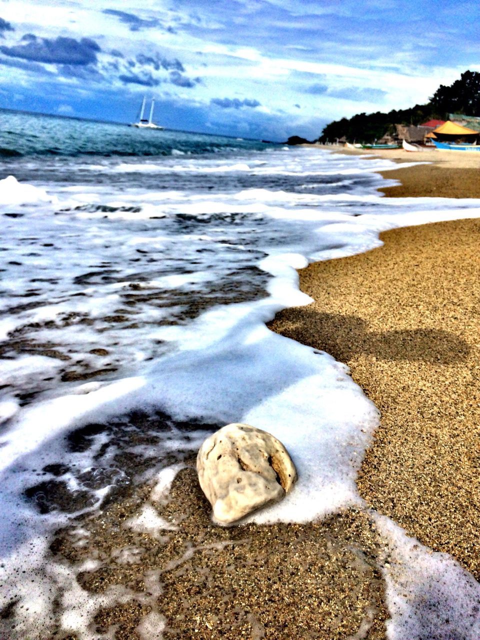 water, beach, sea, shore, surf, sand, wave, sky, tranquility, scenics, tranquil scene, beauty in nature, nature, horizon over water, coastline, cloud - sky, motion, idyllic, day, cloud