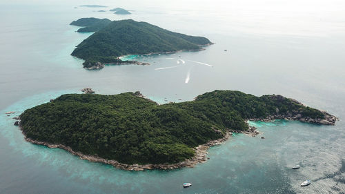 High angle view of sea by mountain