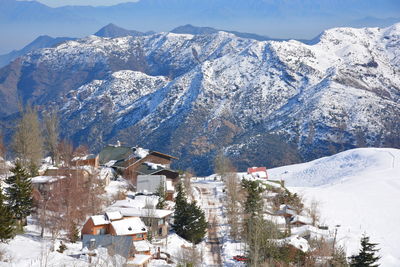 High angle view of houses and mountains during winter