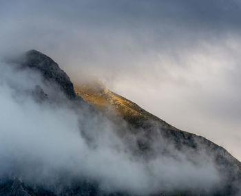 Scenic view of volcanic mountain against sky