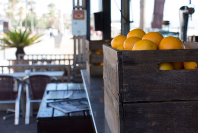 Oranges in crates on table