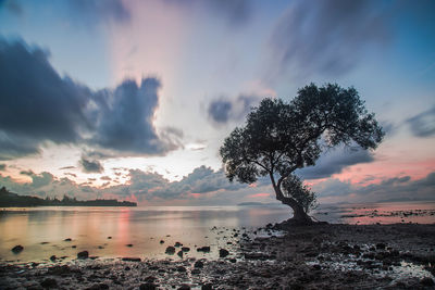 Scenic view of lake against sky during sunset