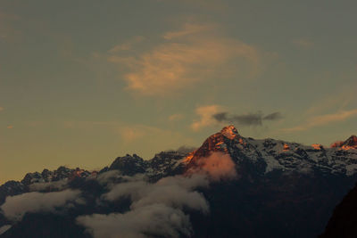 View of snowcapped mountain against sky during sunset