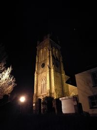 Low angle view of illuminated building at night