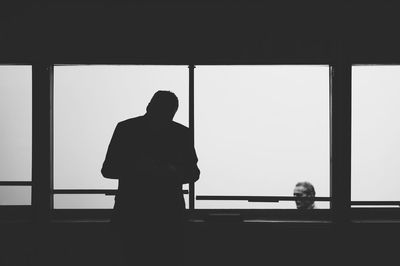 Silhouette of woman in dark background