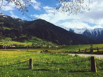 Scenic view of landscape against cloudy sky