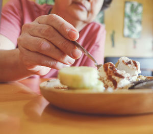 Close-up of hand holding ice cream