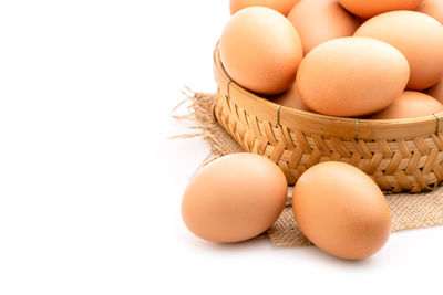 High angle view of eggs in carton against white background