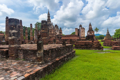 Old temple against cloudy sky