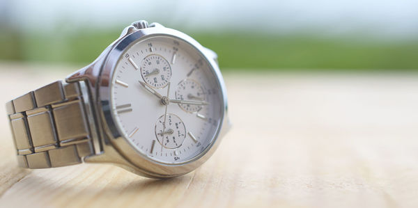 Close-up of clock on table