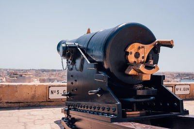 Close-up of coin-operated binoculars against clear sky