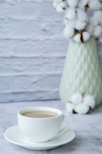 Close-up of coffee cup on table