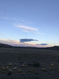 Scenic view of beach against sky during sunset