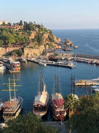 High angle view of sailboats moored at harbor