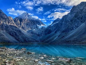 Scenic view of snowcapped mountains against sky