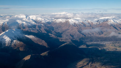 Mountains with snow caps, aerial shot of southern alpa made in queenstown, new zealand
