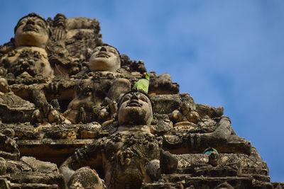 Low angle view of statue against sky