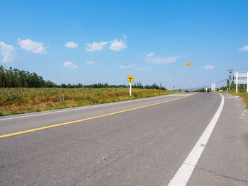 Empty road against sky