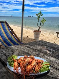 Fresh shrimps served in plate on table at sai noi beach