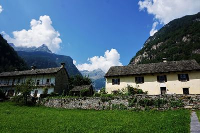 Panoramic shot of building and mountains against sky