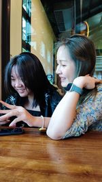 Teenager girls sitting at cafe