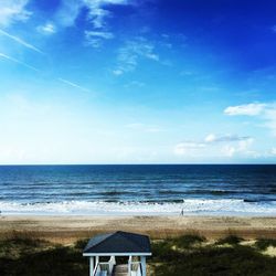 Scenic view of sea against blue sky