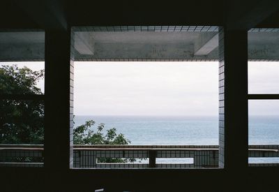 Scenic view of sea seen through window