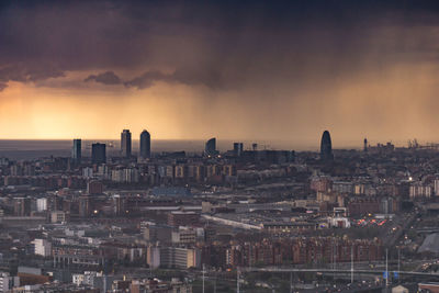 High angle view of buildings against sky during sunset