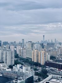 High angle view of buildings in city against sky