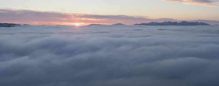 Scenic view of mountains against sky during sunset