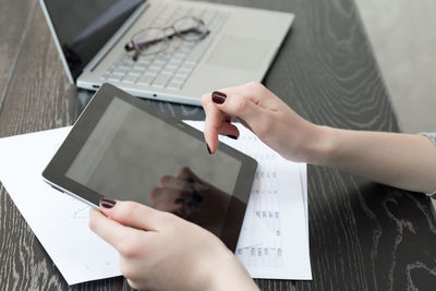 Midsection of person using mobile phone