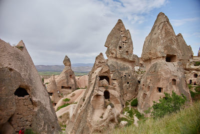 Low angle view of rock formation against sky