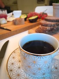 High angle view of coffee cup on table