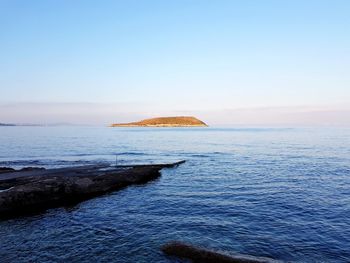 Scenic view of sea against clear sky